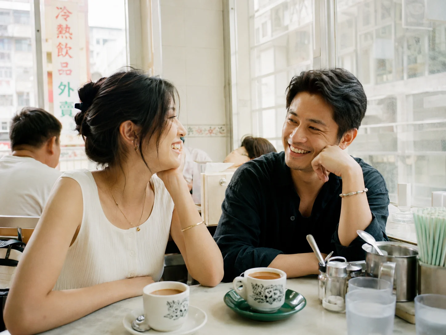 A candid human connection in a bright Hong Kong café
